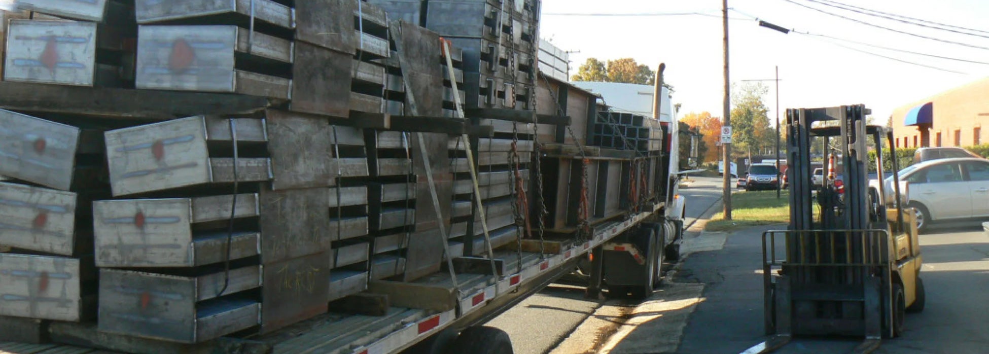 truck with pallets, and a forklift
